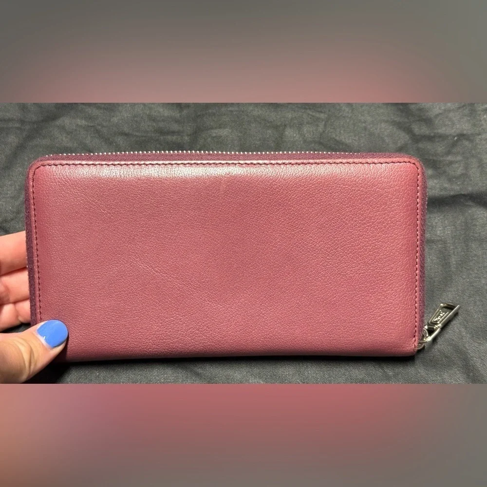 YSL pink Cassandra studded zip around wallet